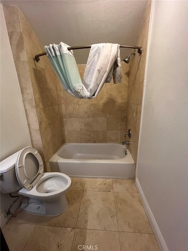 bathroom with shower / bath combo, tile patterned floors, toilet, and baseboards