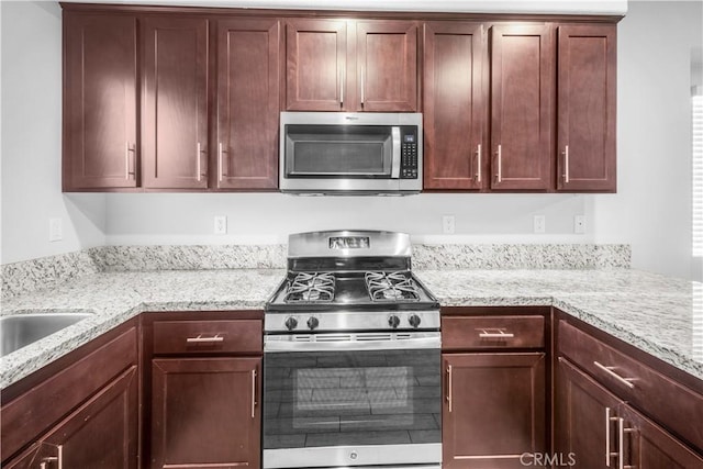 4619 Alekona Ct, Cypress, CA 90630 - kitchen featuring appliances with stainless steel finishes and light stone counters