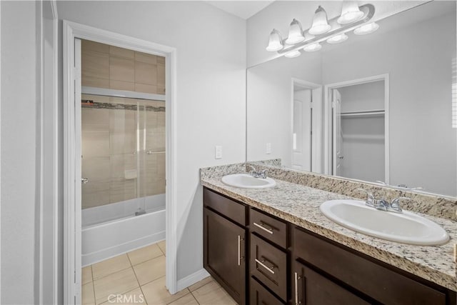 4619 Alekona Ct, Cypress, CA 90630 - full bath with double vanity, tile patterned floors, enclosed tub / shower combo, and a walk in closet