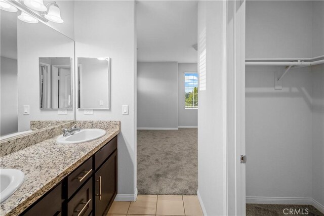 4619 Alekona Ct, Cypress, CA 90630 - full bath featuring double vanity, a spacious closet, and tile patterned flooring