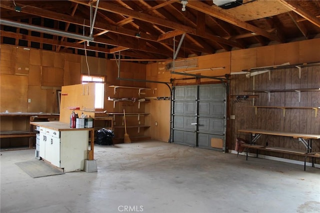 1471 Luna Mesa Rd, Yucca Valley, CA 92284 - garage featuring wood walls and a workshop area