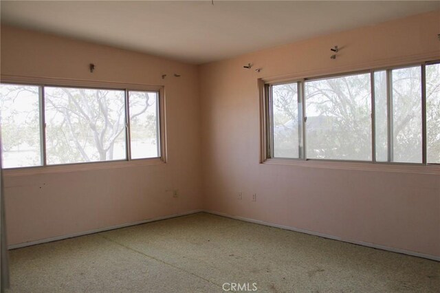 1471 Luna Mesa Rd, Yucca Valley, CA 92284 - unfurnished room featuring plenty of natural light and baseboards