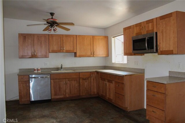 1471 Luna Mesa Rd, Yucca Valley, CA 92284 - kitchen with stainless steel appliances, a sink, and brown cabinetry