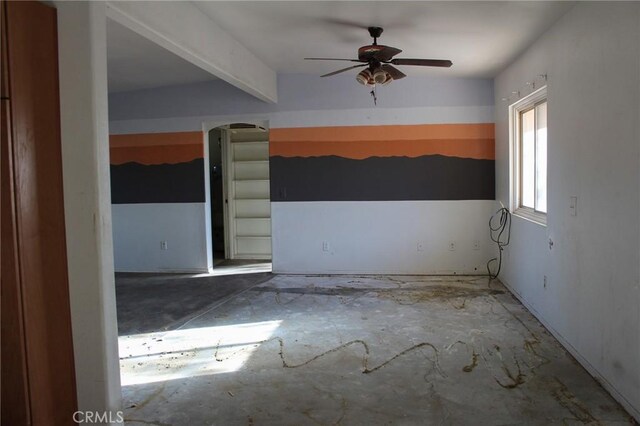 1471 Luna Mesa Rd, Yucca Valley, CA 92284 - empty room with ceiling fan, arched walkways, and beam ceiling