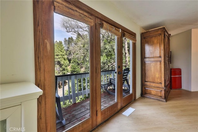 23677 Crest Forest Dr, Crestline, CA 92325 - doorway to outside featuring french doors and light wood-type flooring
