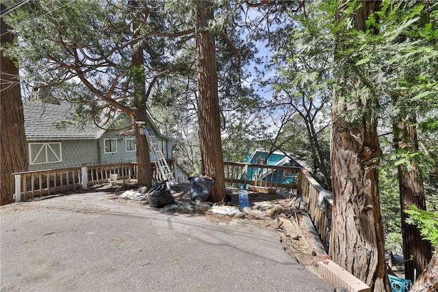 23677 Crest Forest Dr, Crestline, CA 92325 - view of front of home featuring roof with shingles