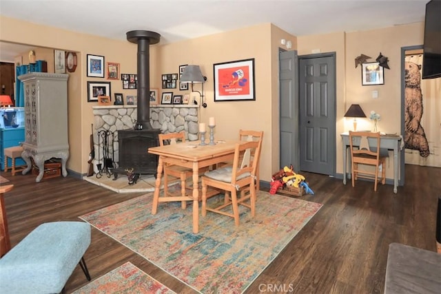 631 Vista Ave, Sugarloaf, CA 92386 - dining room featuring a wood stove and wood finished floors