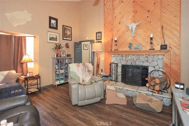 631 Vista Ave, Sugarloaf, CA 92386 - living room with baseboards, a stone fireplace, wood finished floors, and a high ceiling