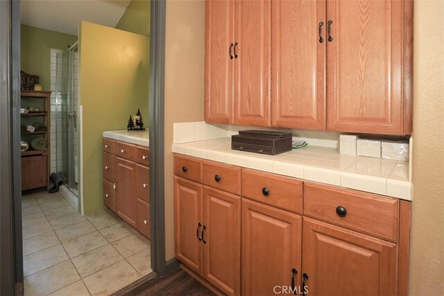 631 Vista Ave, Sugarloaf, CA 92386 - full bath featuring a shower stall and tile patterned flooring