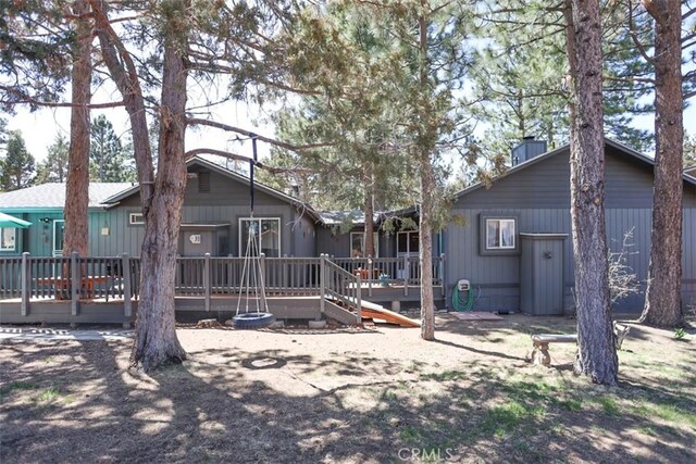 631 Vista Ave, Sugarloaf, CA 92386 - rear view of house featuring a wooden deck and a chimney
