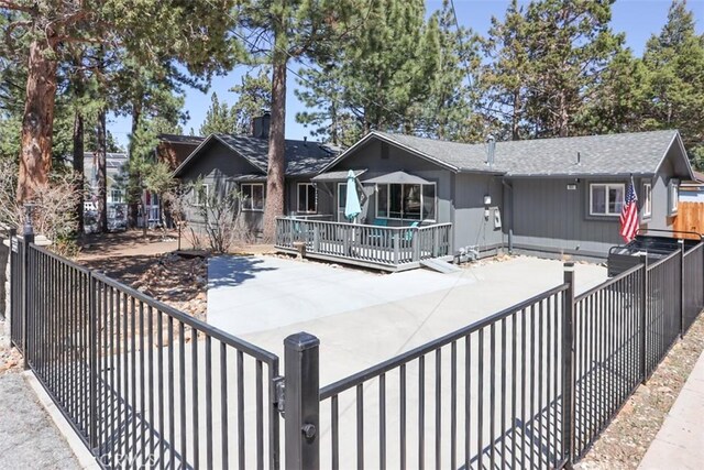 631 Vista Ave, Sugarloaf, CA 92386 - back of house with a gate, fence private yard, a patio area, and a deck