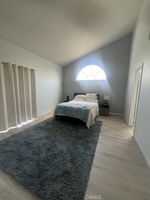 2160 Mariposa Ct, San Jacinto, CA 92583 - bedroom featuring light wood-style flooring, vaulted ceiling, and baseboards