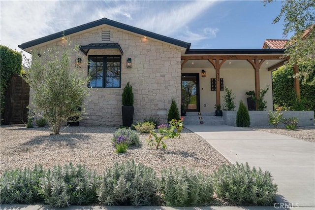 view of front of property with stucco siding and stone siding