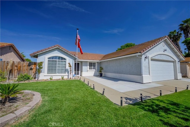 single story home featuring a tiled roof, an attached garage, fence, and a front yard