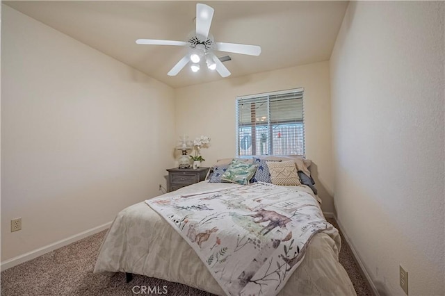 carpeted bedroom with baseboards and a ceiling fan