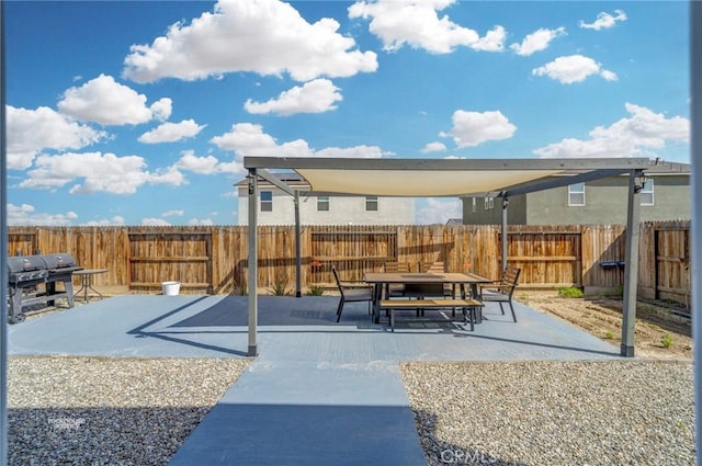 view of play area featuring a patio area, a fenced backyard, and outdoor dining area