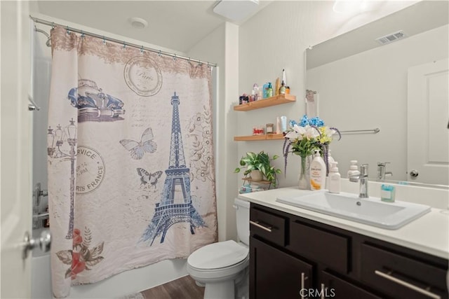 full bathroom with visible vents, toilet, vanity, and wood finished floors