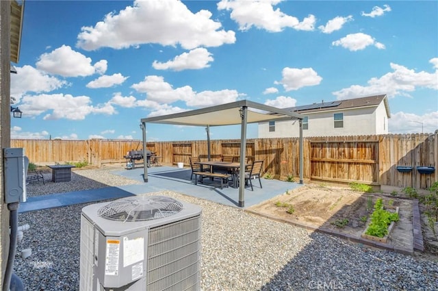 view of yard featuring a patio, a fenced backyard, and central AC unit