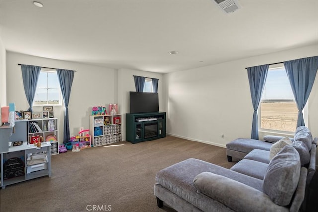 carpeted living area featuring visible vents