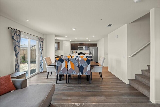 dining space with recessed lighting, stairway, dark wood-style floors, and baseboards