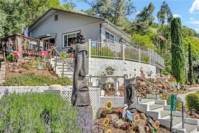 exterior space with fence and stairs