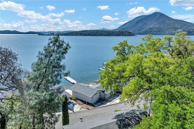 bird's eye view with a water and mountain view
