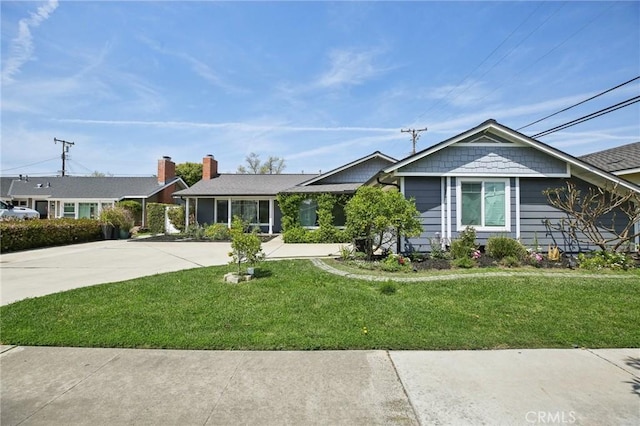 3251 Woodstock Rd, Rossmoor, CA 90720 - ranch-style house with driveway, a chimney, and a front lawn