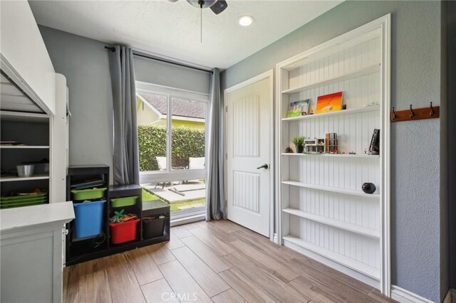3251 Woodstock Rd, Rossmoor, CA 90720 - playroom featuring light wood-style floors and a textured wall