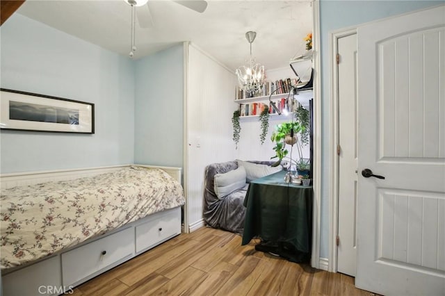 3251 Woodstock Rd, Rossmoor, CA 90720 - bedroom featuring a notable chandelier and wood finished floors