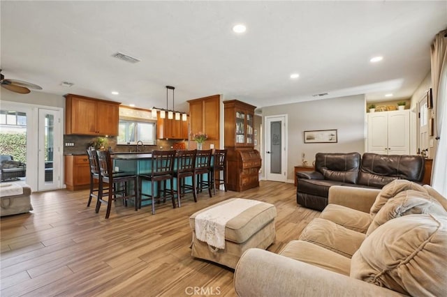 3251 Woodstock Rd, Rossmoor, CA 90720 - living area featuring recessed lighting, light wood-type flooring, and visible vents