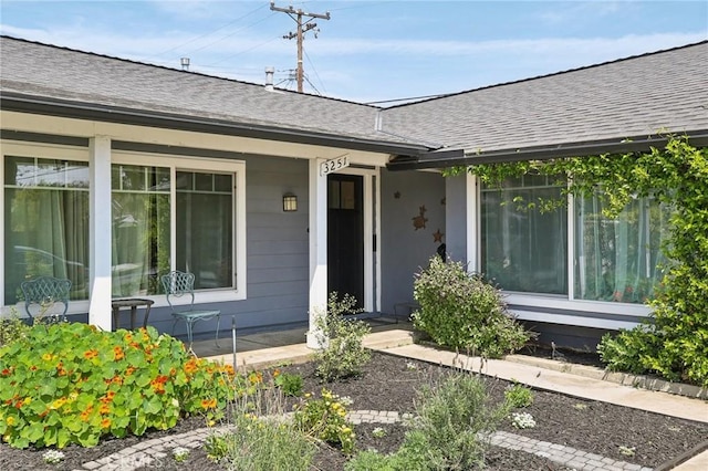 3251 Woodstock Rd, Rossmoor, CA 90720 - view of exterior entry featuring a shingled roof