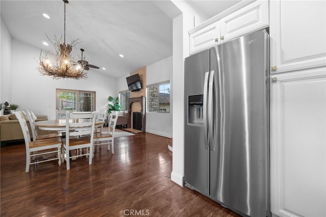 1753 Filbert St, Paso Robles, CA 93446 - dining area featuring dark wood finished floors, a healthy amount of sunlight, a chandelier, and a fireplace