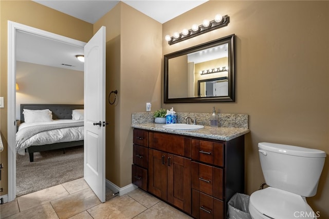 1753 Filbert St, Paso Robles, CA 93446 - ensuite bathroom with tile patterned flooring, visible vents, toilet, vanity, and connected bathroom