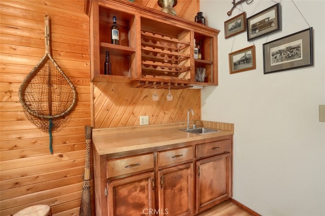 36575 Mudge Ranch Rd, Coarsegold, CA 93614 - bar with light wood-style floors, wet bar, and a sink