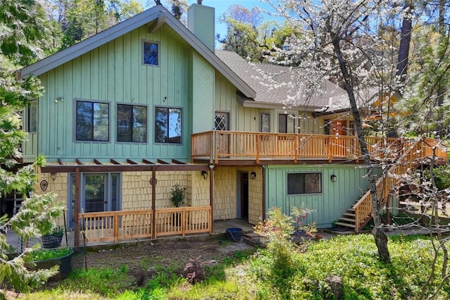 36575 Mudge Ranch Rd, Coarsegold, CA 93614 - rear view of house featuring a shingled roof, stairway, a wooden deck, and a chimney
