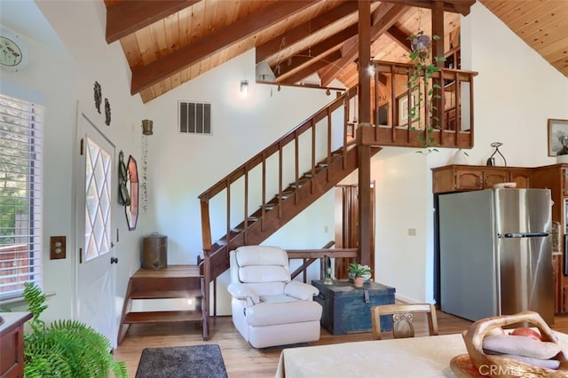 36575 Mudge Ranch Rd, Coarsegold, CA 93614 - interior space featuring visible vents, beamed ceiling, high vaulted ceiling, wooden ceiling, and wood finished floors