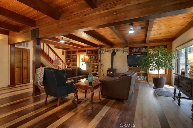 36575 Mudge Ranch Rd, Coarsegold, CA 93614 - living room with ceiling fan, beamed ceiling, dark wood-type flooring, stairway, and wood ceiling