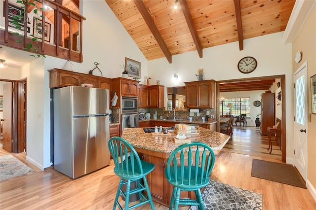 36575 Mudge Ranch Rd, Coarsegold, CA 93614 - kitchen featuring wooden ceiling, light wood-type flooring, appliances with stainless steel finishes, high vaulted ceiling, and a kitchen island