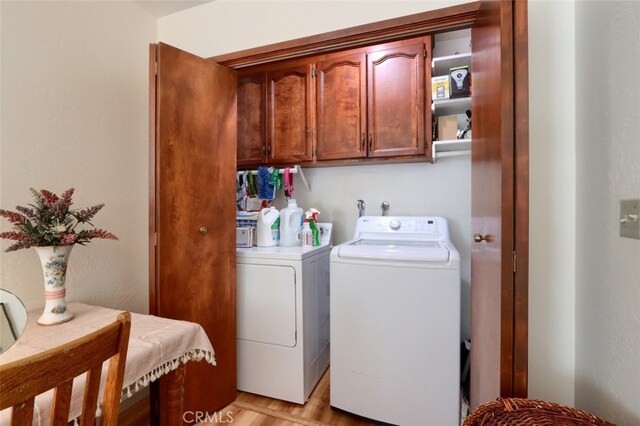 36575 Mudge Ranch Rd, Coarsegold, CA 93614 - washroom featuring washing machine and clothes dryer and cabinet space