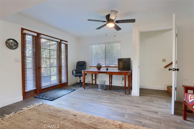 36575 Mudge Ranch Rd, Coarsegold, CA 93614 - office space with baseboards, wood finished floors, and ceiling fan