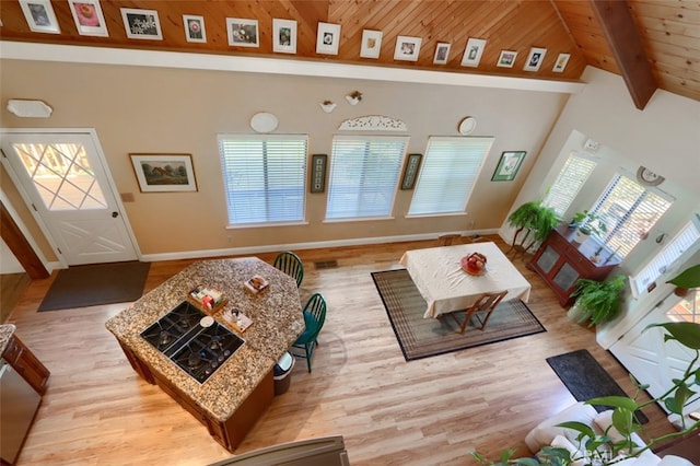 36575 Mudge Ranch Rd, Coarsegold, CA 93614 - living room with wood ceiling, baseboards, beam ceiling, and wood finished floors