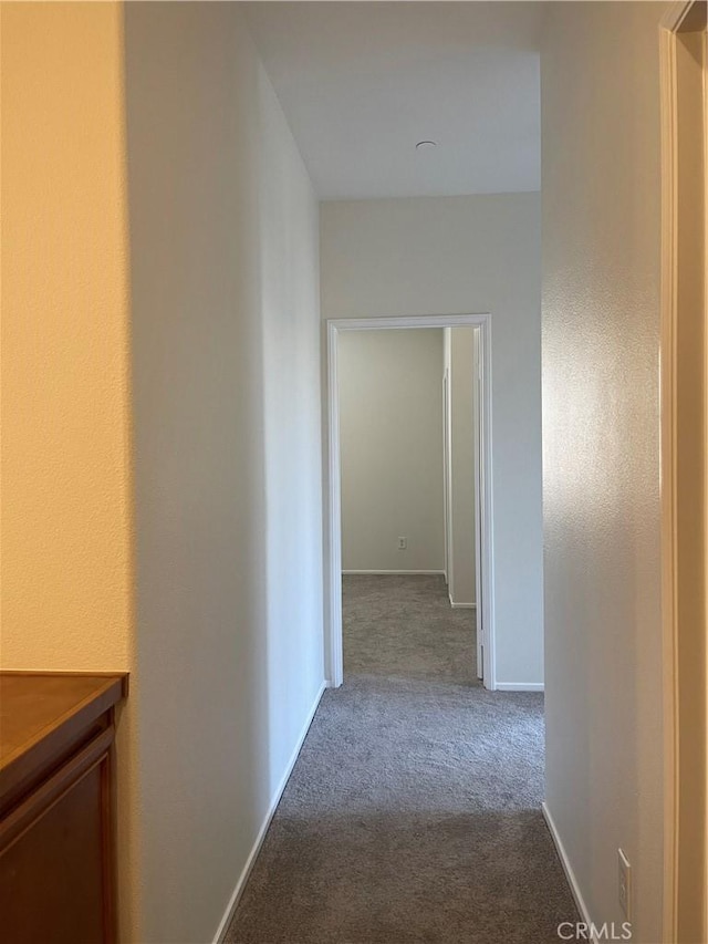 1800 E Lakeshore Dr Unit 302, Lake Elsinore, CA 92530 - hallway with baseboards and carpet