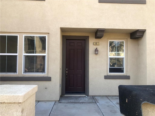 1800 E Lakeshore Dr Unit 302, Lake Elsinore, CA 92530 - view of exterior entry with stucco siding