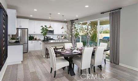8800 Newcastle St, Hesperia, CA 92345 - dining space featuring light wood finished floors and recessed lighting