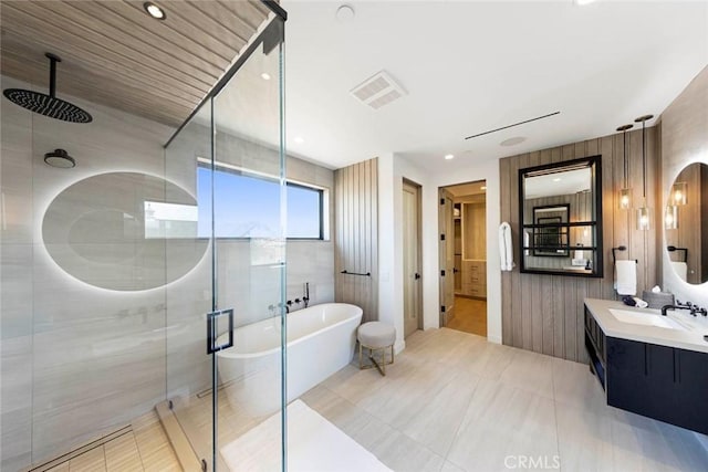 full bath with a freestanding bath, a shower stall, visible vents, and vanity