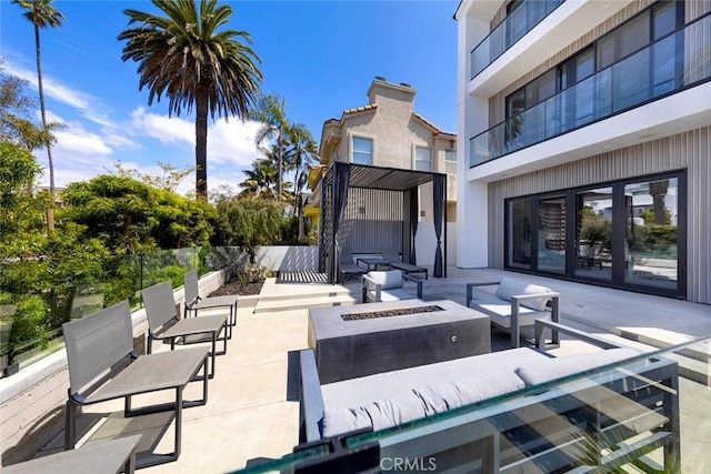 view of patio / terrace featuring french doors and an outdoor fire pit