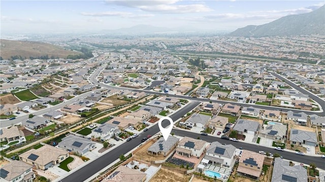 view of property location with mountains and nearby suburban area