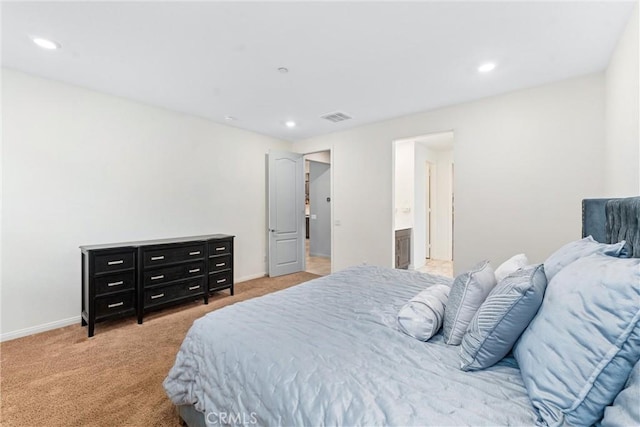 bedroom with light colored carpet, recessed lighting, and baseboards