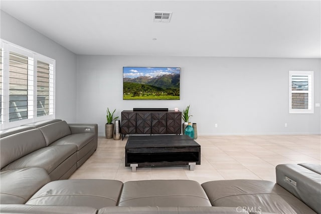 21123 Mill Valley Ct, Riverside, CA 92507 - living room with healthy amount of natural light and light tile patterned floors