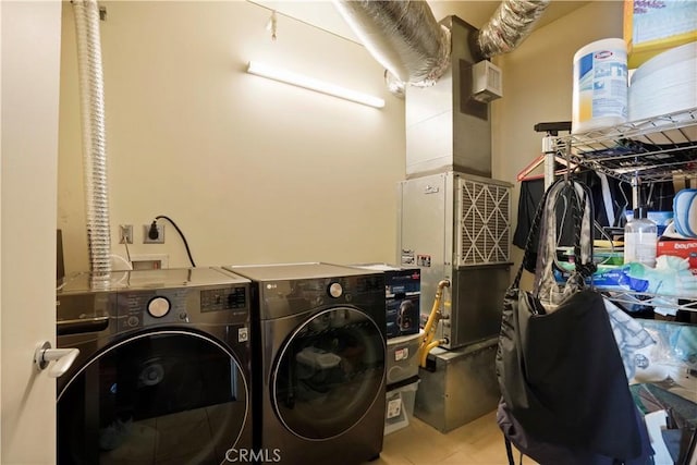 laundry area featuring laundry area, tile patterned flooring, and washer and dryer